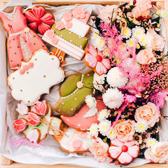 box with spring flowers, cookies and cakes. Pink and white flowers. gift for mother's day. gift for Valentine's day.