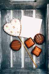 A box of cookies with a signature card. gift box with cookies. culinary mastic. gift for Valentine's day. mothers Day. heart shaped cookies