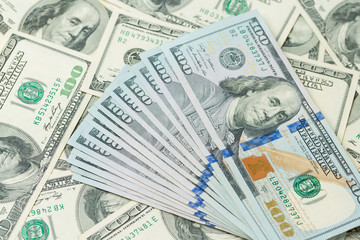 Background of one hundred dollar bills. Benjamin Franklin on USA money banknote