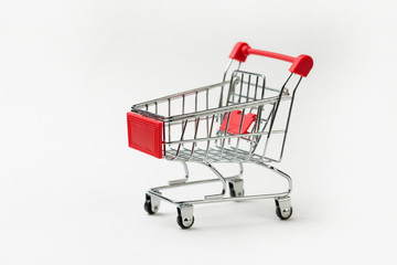Grocery cart with Bitcoin wheels. The concept of technological breakthrough, online shopping.	
