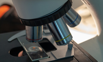 microscope, examining samples and liquid. technical equipment