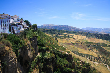 View on ancient village Ronda located on plateau surrounded by rural plains in Andalusia, Spain