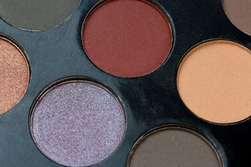 Colorful eye shadows palette. Colorful make-up palette background.