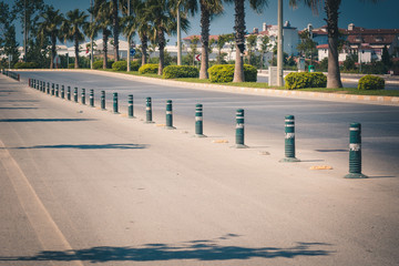 Large road in two directions divided by pillars.