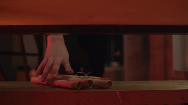 A room,a muffled light,a wooden shelf on which lie four paper scrolls tied with a rope. through the shelves you can see how a man approaches and takes the scrolls in his hand. The concept of the quest