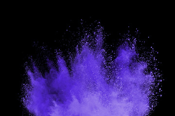 Abstract powder splatted background. Colorful powder explosion on black background. 