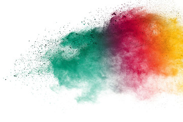 Freeze motion of colorful color powder exploding on white background.  Paint Holi.