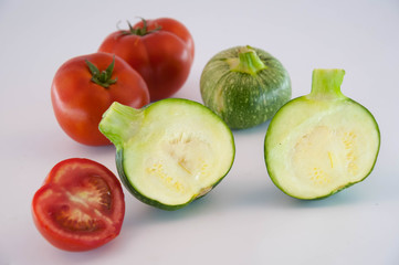 Green zucchini and  tomatos
