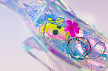 Summer background, beach holiday and travel concept with trendy hologram style bag