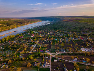 Arial view over the river and small village.