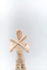 Refusal gesture, Wooden dummy, crossed hands on white background, copy space for your object or text