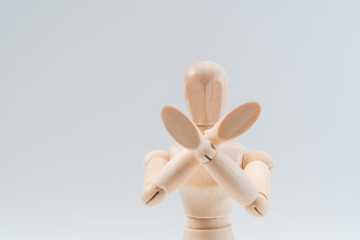 Refusal gesture, Wooden dummy, crossed hands on white background, copy space for your object or text