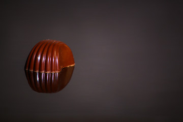 chocolate candies (sweets with filling) exquisite dessert chocolates. food background. top