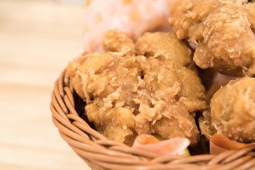 Breaded crispy fried chicken drumctick in the basket