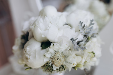 A wedding bouquet of roses. White roses on the grass.