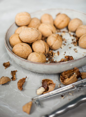 whole walnuts in a plate, top view