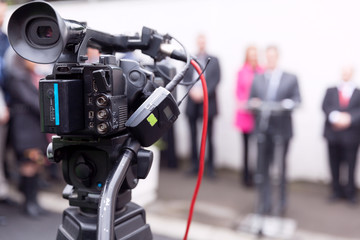 Filming news or press conference with a video camera