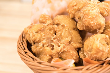 Breaded crispy fried chicken drumctick in the basket