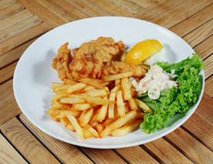 Fish and chips  with french fries and vegetables