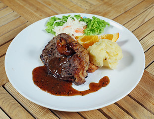 Western food , steak on a white plate ready to be serve.