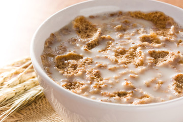 Oats milk and cereals on wooden table. Close up
