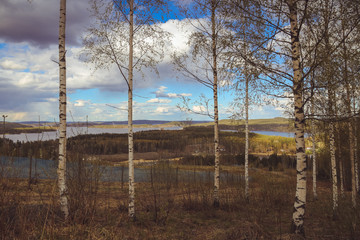 Obraz premium beautiful views of the mountains to the lakes, houses, birches and forest. Finnish landscape. Lakes and valley. Karelia