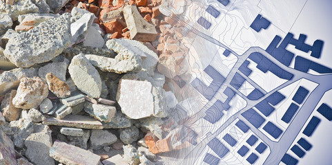Concrete and brick rubble debris on construction site after a demolition of a brick building -...