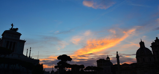 Beautiful sunset over Rome historical center monuments in the central Piazza Venezia (Venice Square)