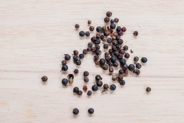 black pepper on wooden