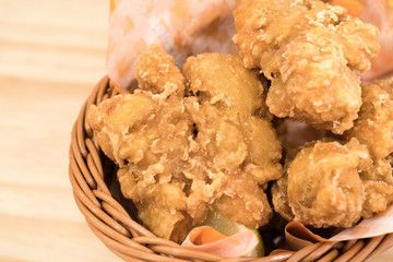 Breaded crispy fried chicken drumctick in the basket