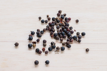 black pepper on wooden