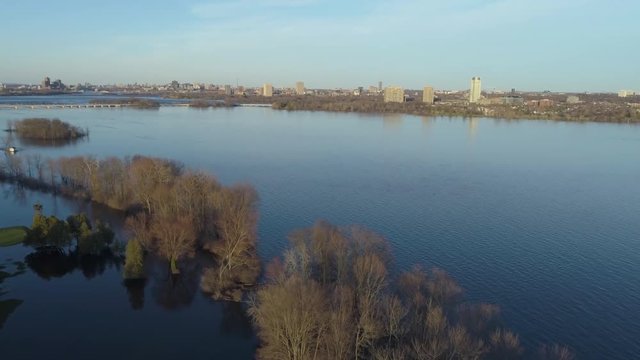 Ottawa river flooding view by drone in 2019 from Quebec towards Ottawa and Champlain Bridge at sunset.