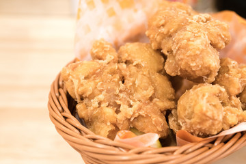 Breaded crispy fried chicken drumctick in the basket