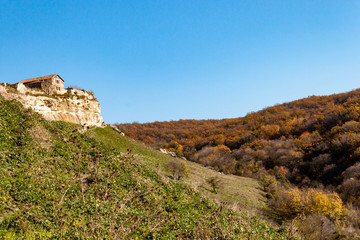 Fototapeta na wymiar Old stone houses of Medieval cave city-fortress Chufut-Kale in the mountains, Bakhchisaray, Crimea