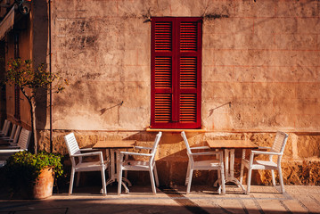 Fototapeta na wymiar Summer vacation, holiday photo. Chairs on the Mediterranean street