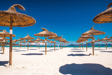 Summer holiday, umbrella on the tropical sandy beach
