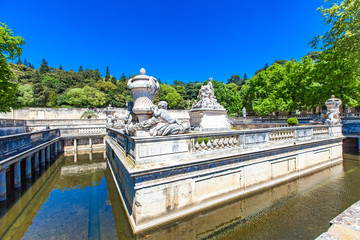 A beautiful fountain in the Jardin de la fontaine in Nimes, France