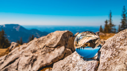 Crystal ball alpine landscape shot at the famous Kampenwand summit-Aschau-Chiemgau-Bavaria-Germany