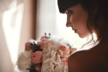 Beautiful bride woman portrait in white dress. Fashion Beauty Girl. Make up. Jewelry. Manicured nails. Wedding girl in luxury wedding dress