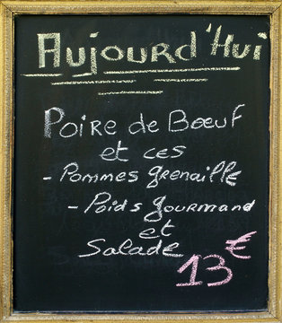 Menu blacboard outside a French restaurant.