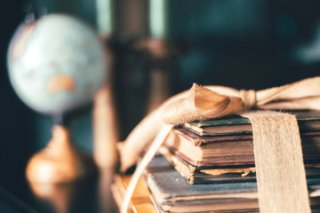 Globe and Vintage Books on Dusty Old Table