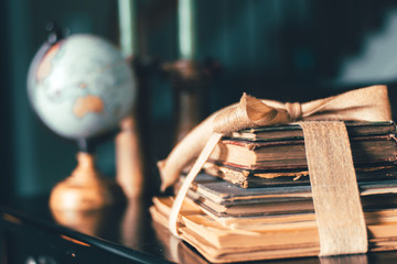 Globe and Vintage Books on Dusty Old Table