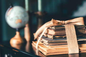 Globe and Vintage Books on Dusty Old Table
