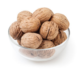 Walnuts in glass bowl isolated on white background with clipping path