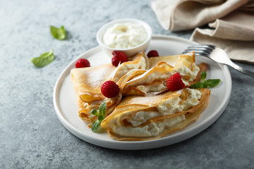 Crepes stuffed with cottage cheese cream