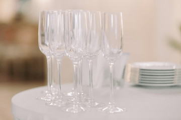 row of empty glasses on the restaurant table