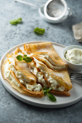 Crepes stuffed with cottage cheese cream