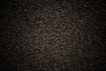 stone background black color with a grainy texture