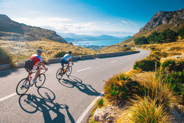 Estores personalizados de deportes con tu foto Road cycling photo. Two triathlete train in beautiful nature. Sea and mountains in background. Alcudia, Mallorca, Spain