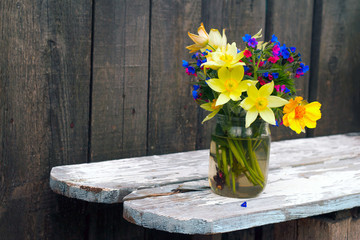 bouquet of wildflowers on a wooden background